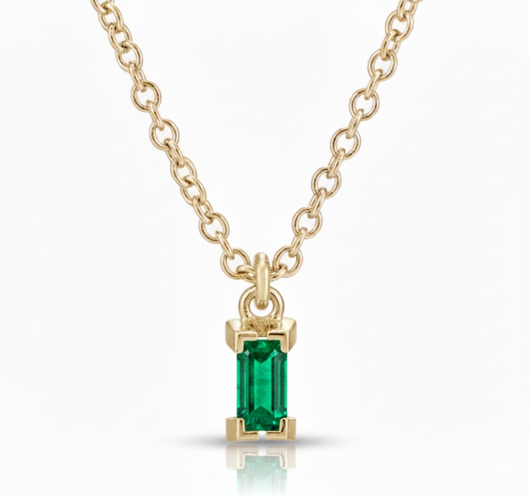 minimalist 14ct gold chain Colombian baguette shaped emerald, cruelty free